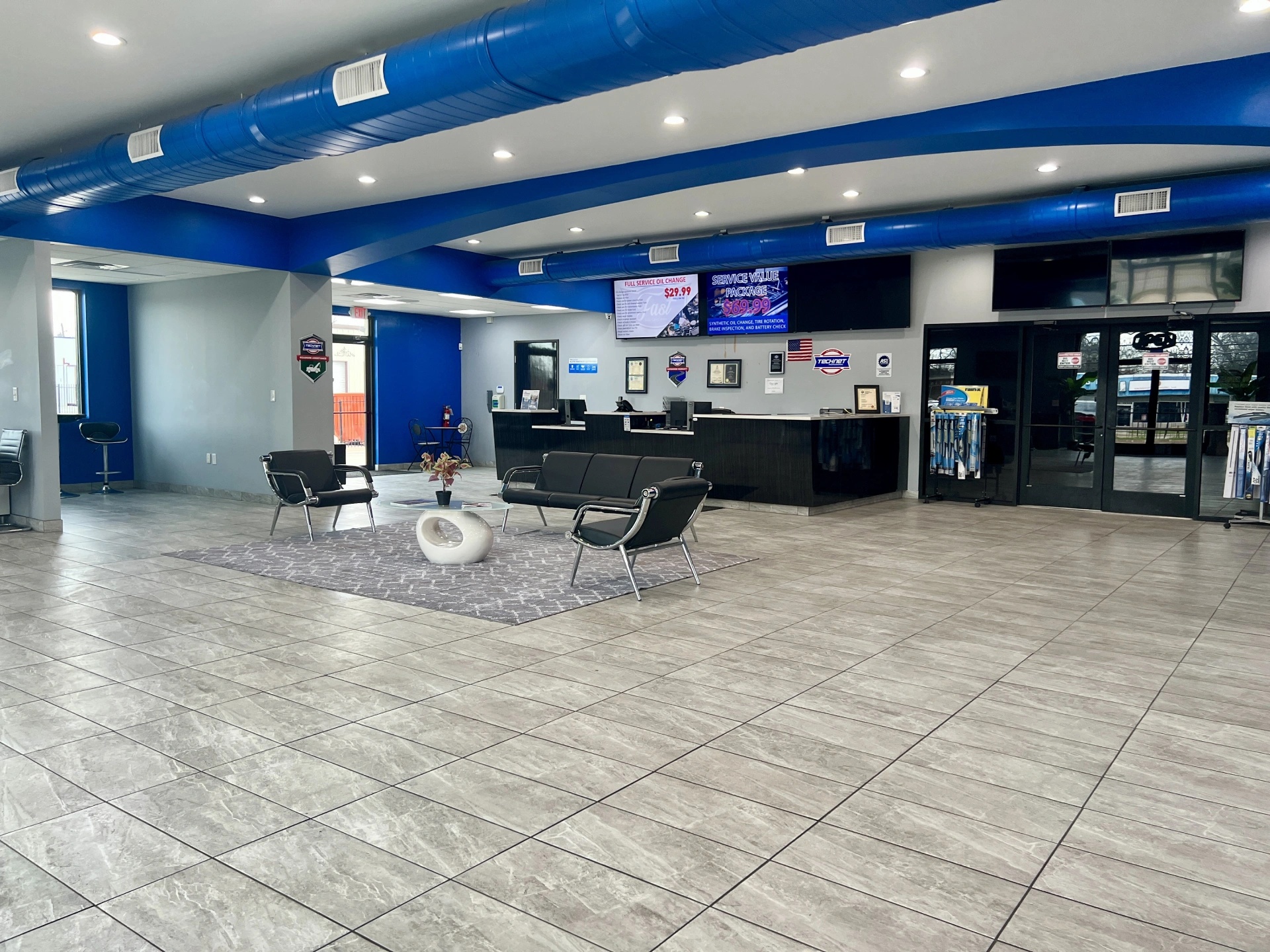 Customer waiting area and service desk inside Firestone Buckner auto repair shop in Buckner MO